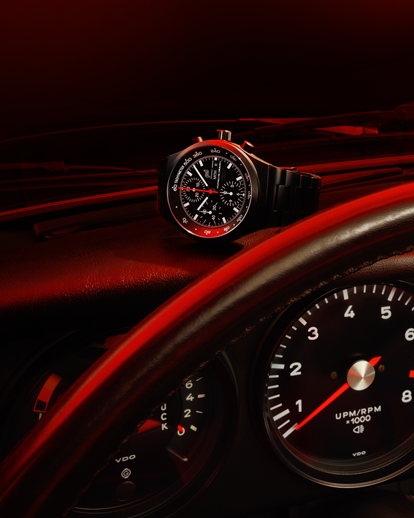 Shows Picture of chronograph1-all-black-numbred-edition-on-911-dashboard.png